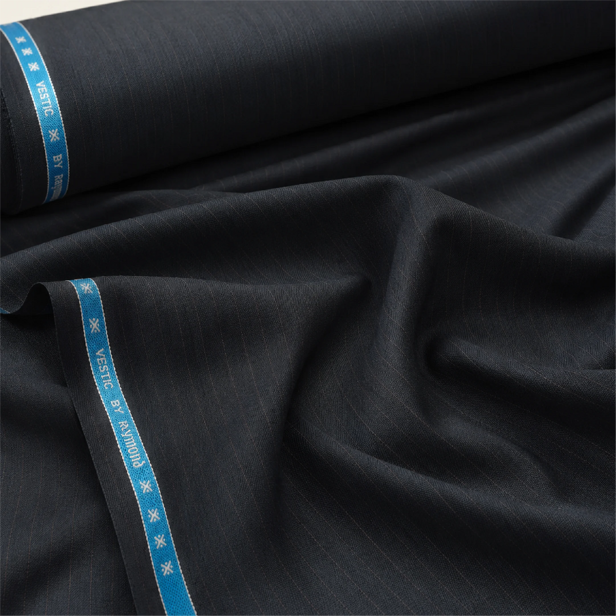 Folded Raymond Vestic charcoal pinstripe unstitched suiting fabric