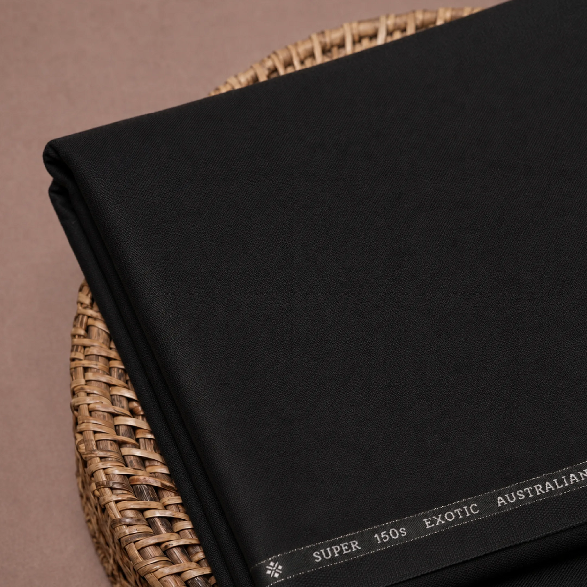 Close-up of OCM Aristo Merino Wool 150 black unstitched suiting fabric