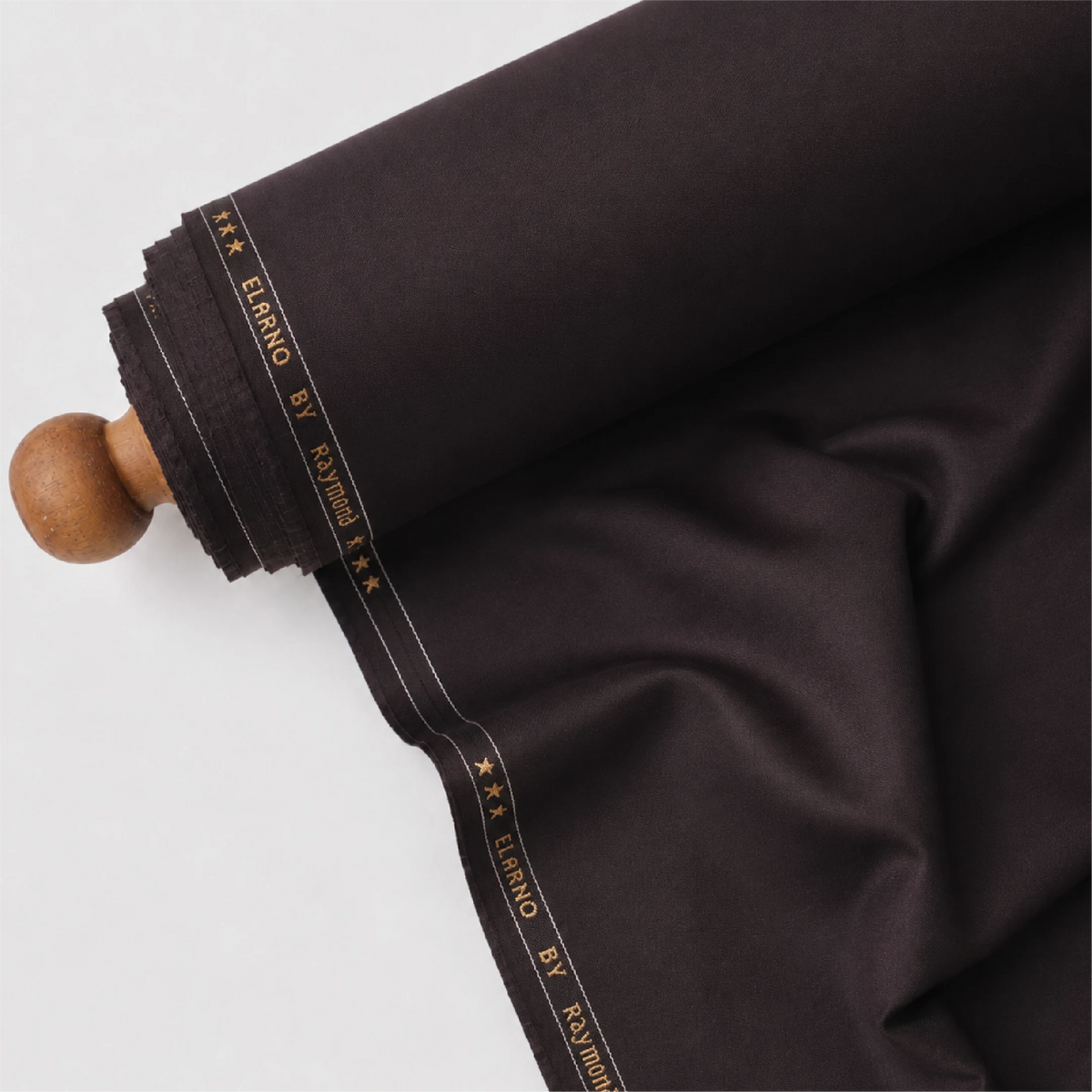 Rolled Raymond Elarno dark wine suiting fabric showing its smooth texture