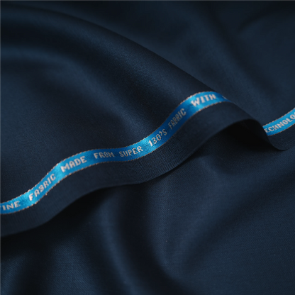 Close-up of Raymond Lexican Merino Wool 130 dark navy blue fabric with branded selvedge