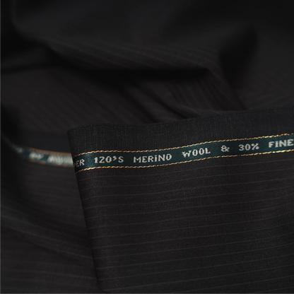 Close-up of Raymond Lexican Merino Wool 130 dark teal fabric with red checks and branded selvedge